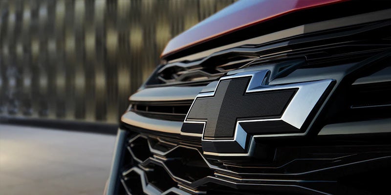 Close-up of the Chevrolet logo on the front grille of a Chevrolet Equinox.