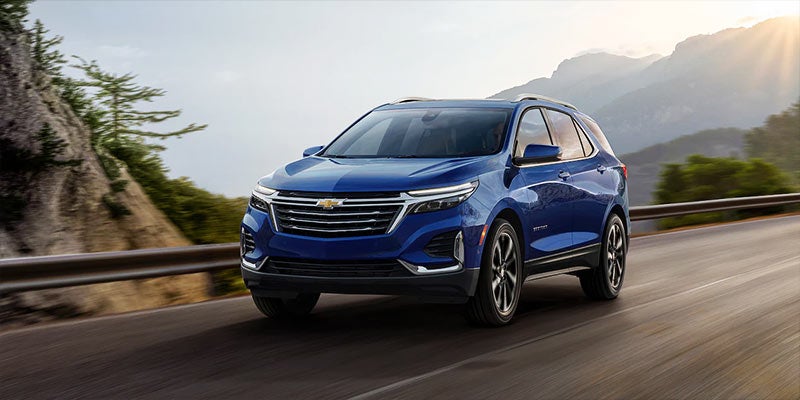 Chevrolet Equinox driving smoothly on the highway, showcasing its sleek design and comfortable ride.